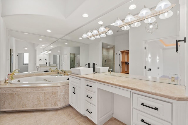 bathroom featuring tile patterned flooring, recessed lighting, vanity, a bath, and a stall shower