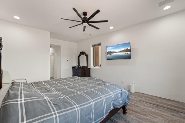 bedroom featuring ceiling fan and hardwood / wood-style floors