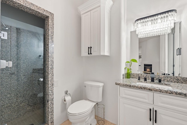 full bath featuring toilet, a warm lit fireplace, a shower stall, and vanity