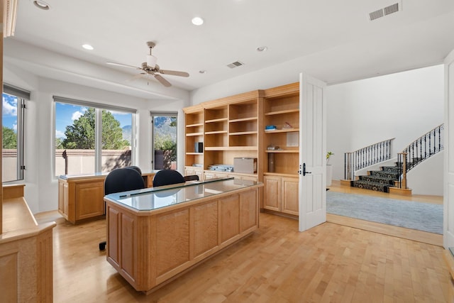 home office with light wood-style floors, ceiling fan, visible vents, and recessed lighting