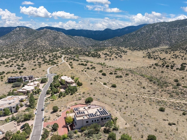 birds eye view of property with a mountain view