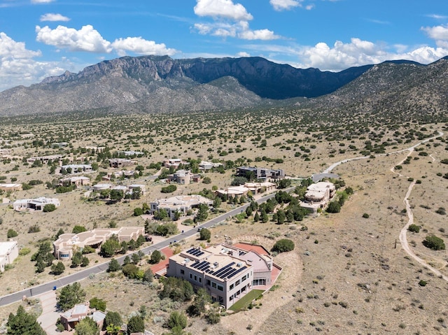 bird's eye view with view of desert and a mountain view