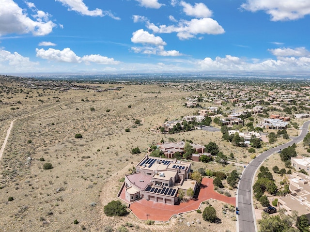 birds eye view of property featuring a desert view