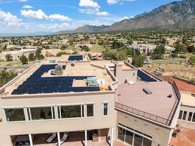 birds eye view of property with a mountain view