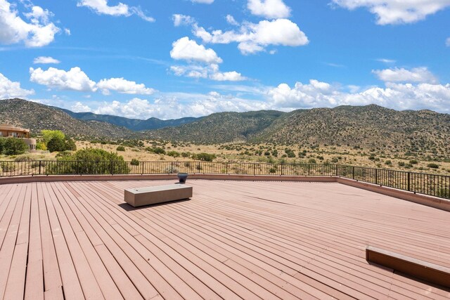 wooden deck featuring a mountain view