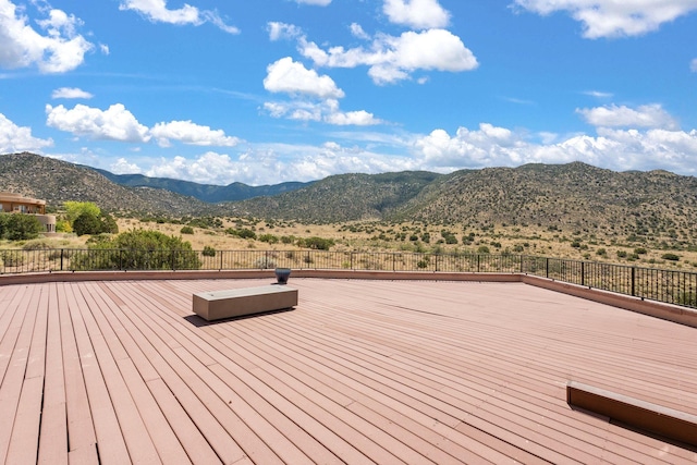 wooden deck with a mountain view