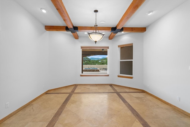 empty room with beamed ceiling