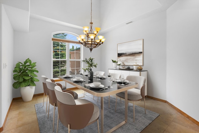 dining area featuring a notable chandelier