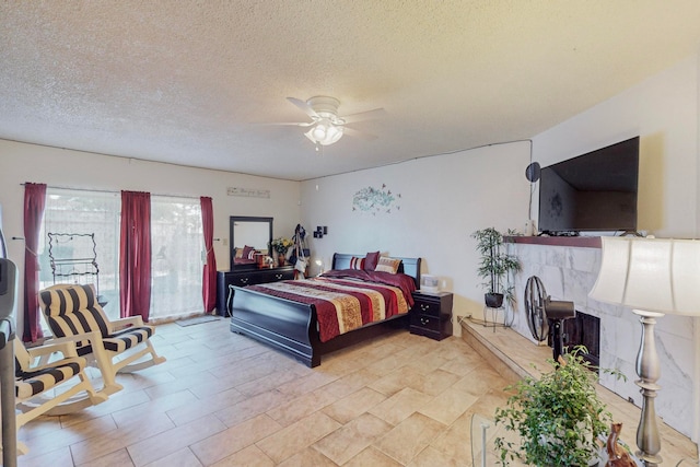 bedroom featuring a textured ceiling and ceiling fan