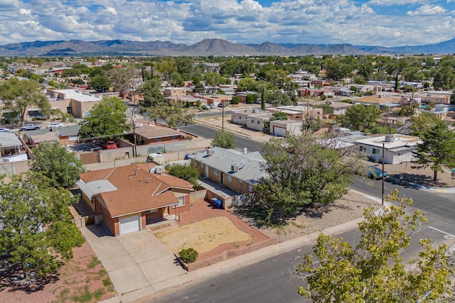 birds eye view of property with a mountain view