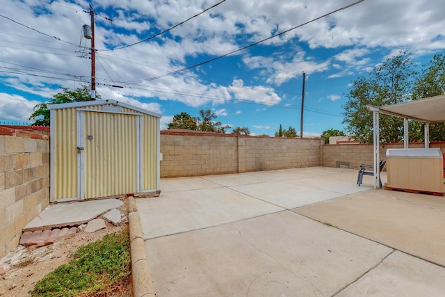 view of patio with a shed