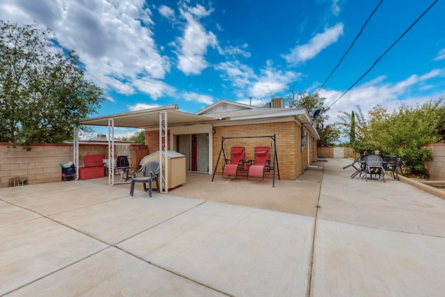 rear view of house with a patio