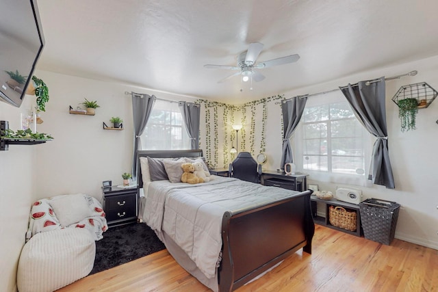 bedroom featuring ceiling fan and light hardwood / wood-style floors