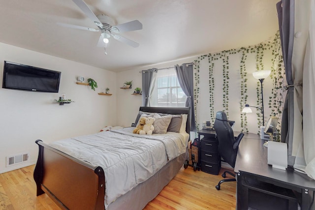 bedroom with light wood-type flooring and ceiling fan