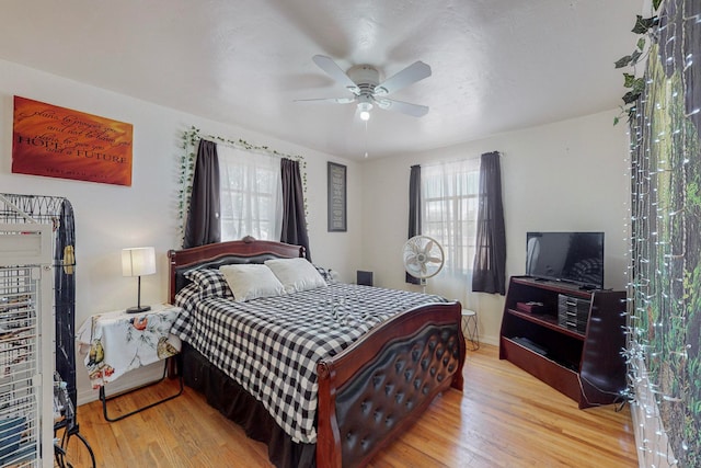 bedroom featuring ceiling fan and light hardwood / wood-style floors