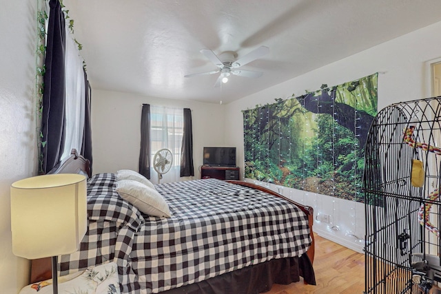 bedroom featuring ceiling fan and light wood-type flooring