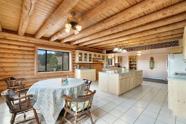 tiled dining room with wooden ceiling, sink, a baseboard radiator, rustic walls, and beam ceiling