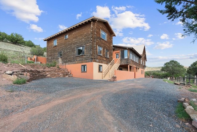 view of property exterior with a garage