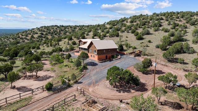 birds eye view of property featuring a rural view