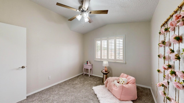 living area with lofted ceiling, light carpet, and ceiling fan