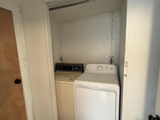 washroom featuring washing machine and dryer