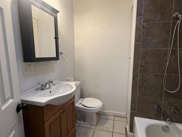 bathroom featuring vanity, tile patterned floors, and toilet