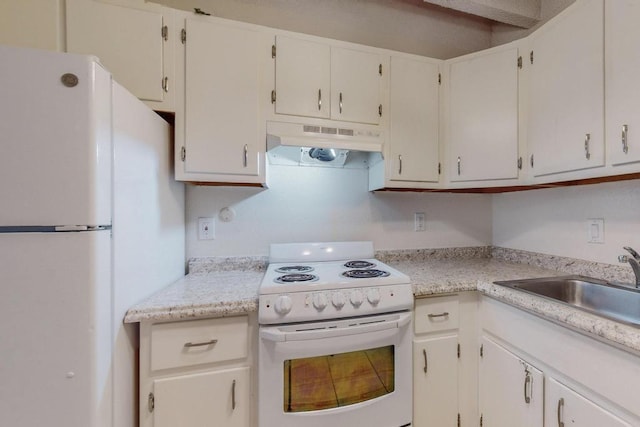 kitchen featuring sink, white appliances, and white cabinets