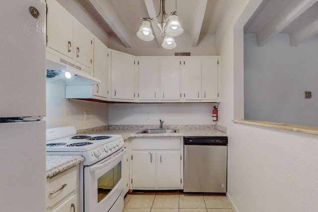 kitchen with sink, white appliances, white cabinetry, hanging light fixtures, and light tile patterned flooring