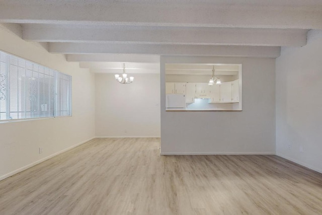 empty room featuring an inviting chandelier, beam ceiling, and light hardwood / wood-style floors