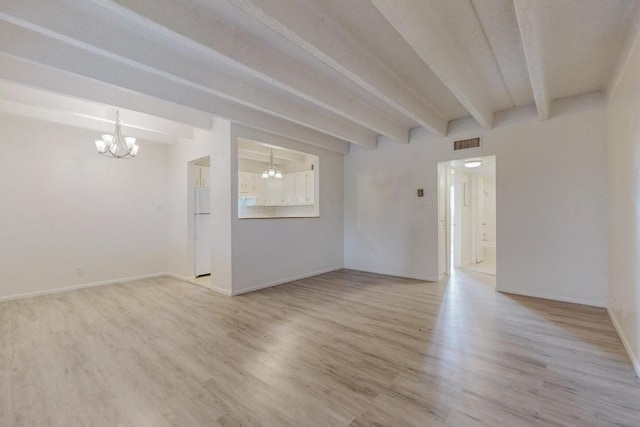 empty room with a notable chandelier, beam ceiling, and light wood-type flooring