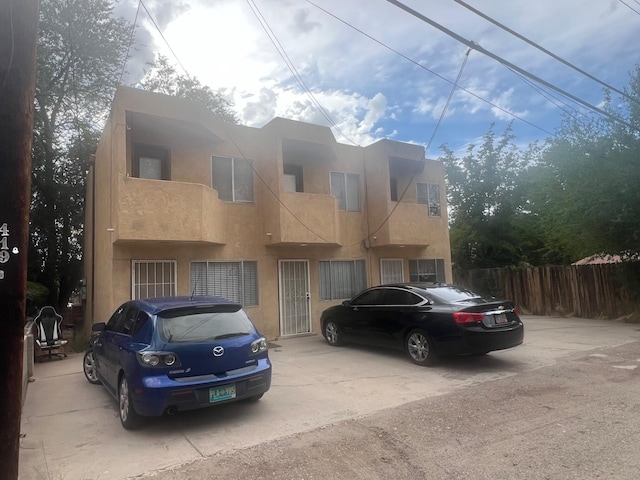 view of front of house with a balcony