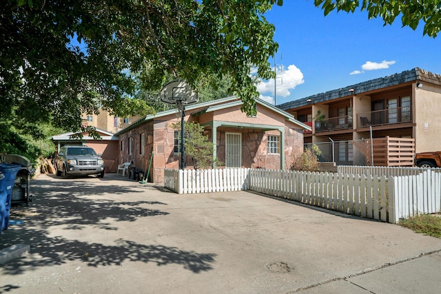 view of front of home featuring a balcony