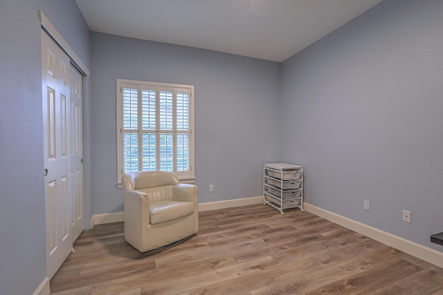 unfurnished room featuring light wood-style flooring and baseboards