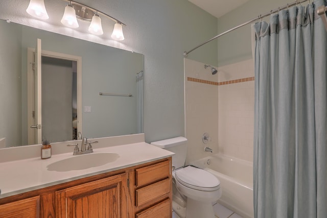 full bathroom featuring a textured wall, vanity, shower / bath combination with curtain, and toilet