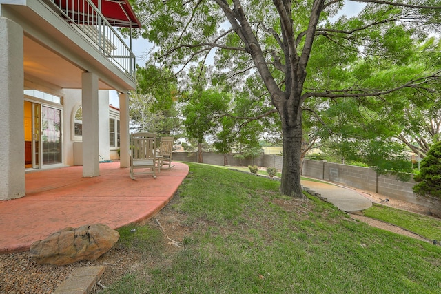 view of yard featuring a patio area and a fenced backyard