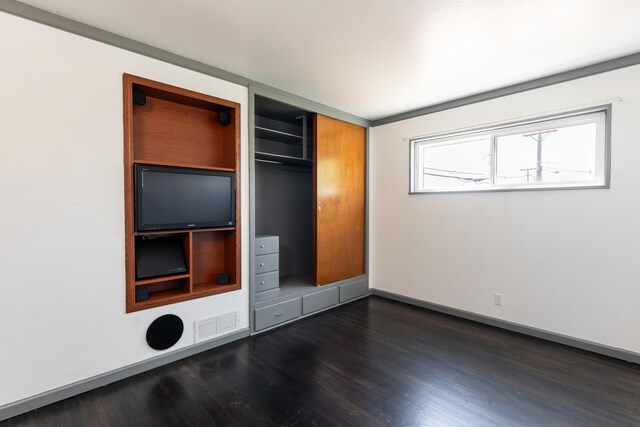 empty room featuring dark hardwood / wood-style floors