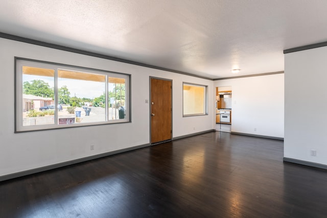 unfurnished room with ornamental molding, dark hardwood / wood-style flooring, and a textured ceiling