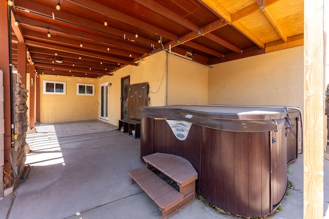 view of patio / terrace with a hot tub