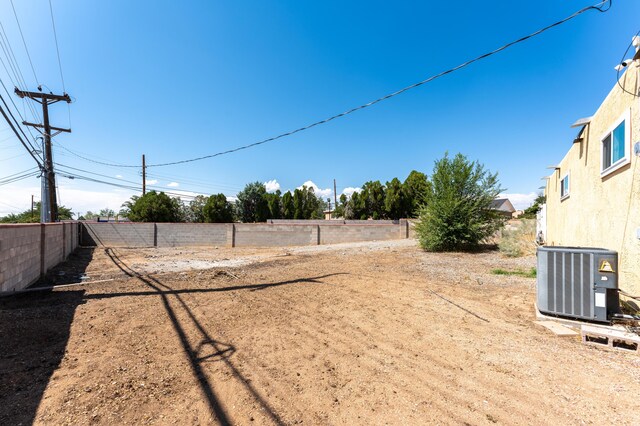 view of yard with central AC unit