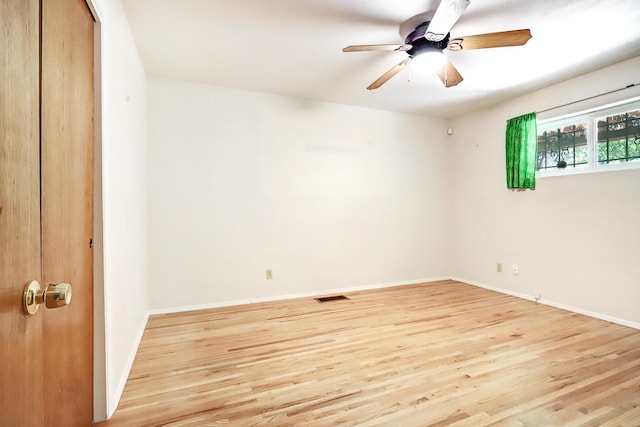 unfurnished room with ceiling fan and light hardwood / wood-style floors