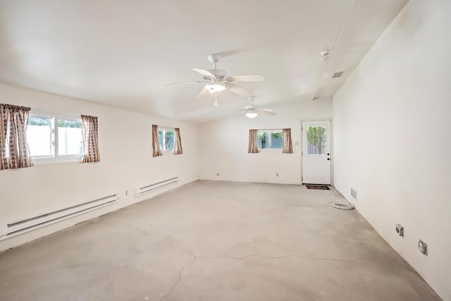 spare room with ceiling fan, vaulted ceiling, and a baseboard heating unit