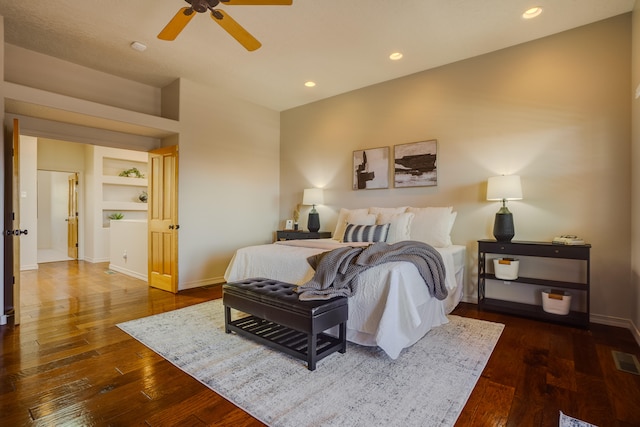 bedroom with dark wood-type flooring and ceiling fan