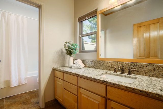 bathroom featuring vanity and shower / bath combo with shower curtain