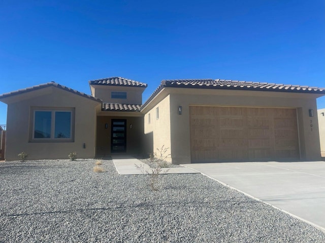 mediterranean / spanish-style house featuring a garage