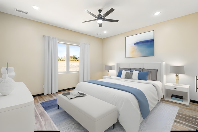 bedroom featuring ceiling fan and light hardwood / wood-style flooring