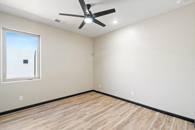 unfurnished room featuring light wood-type flooring and ceiling fan