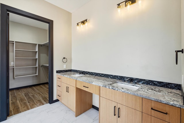 bathroom with vanity and hardwood / wood-style floors