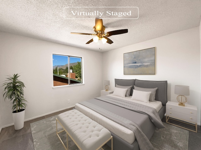 carpeted bedroom featuring a textured ceiling and ceiling fan