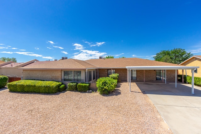 single story home featuring a carport