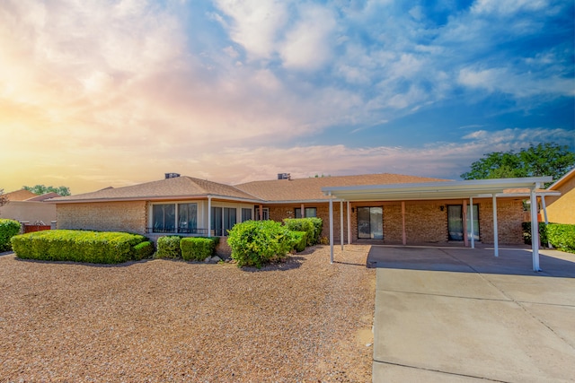 ranch-style house with a carport